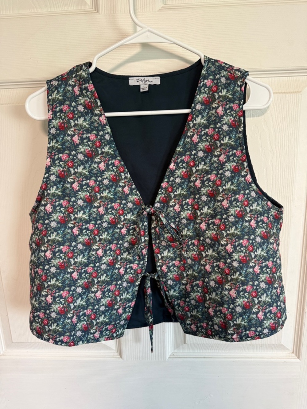 Polagram Navy Top with Subtle Floral Accent